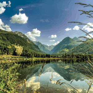 Mountain lake with clear sky and reflections.